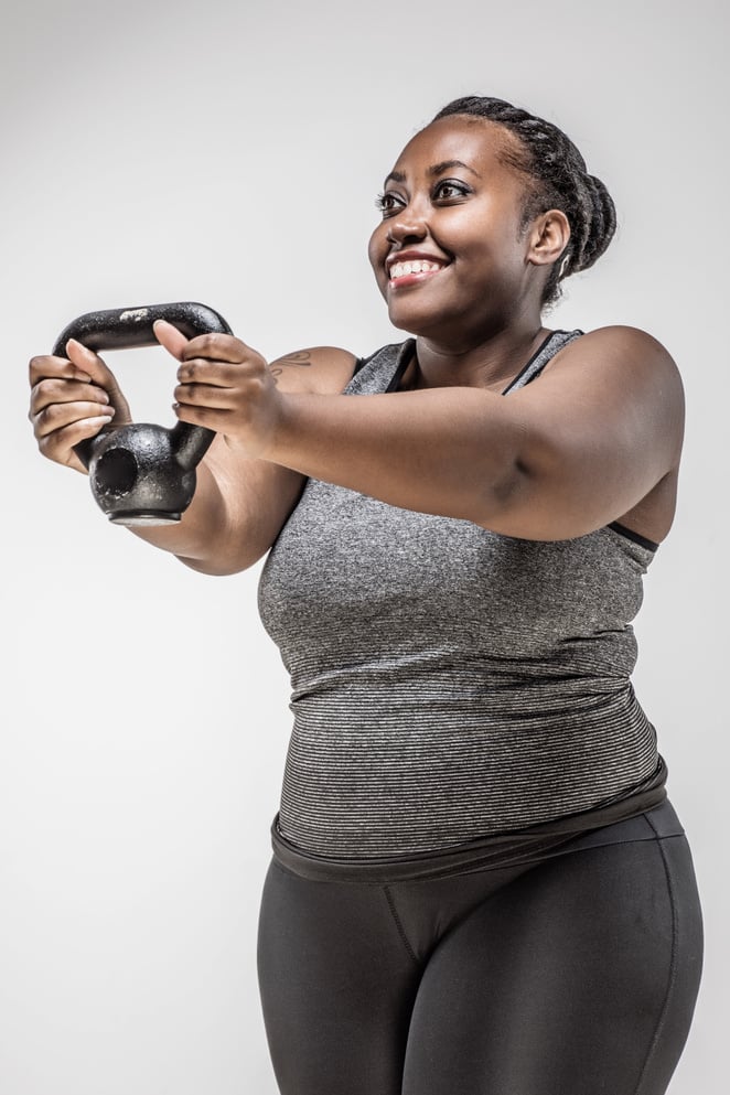 Overweight black woman working out